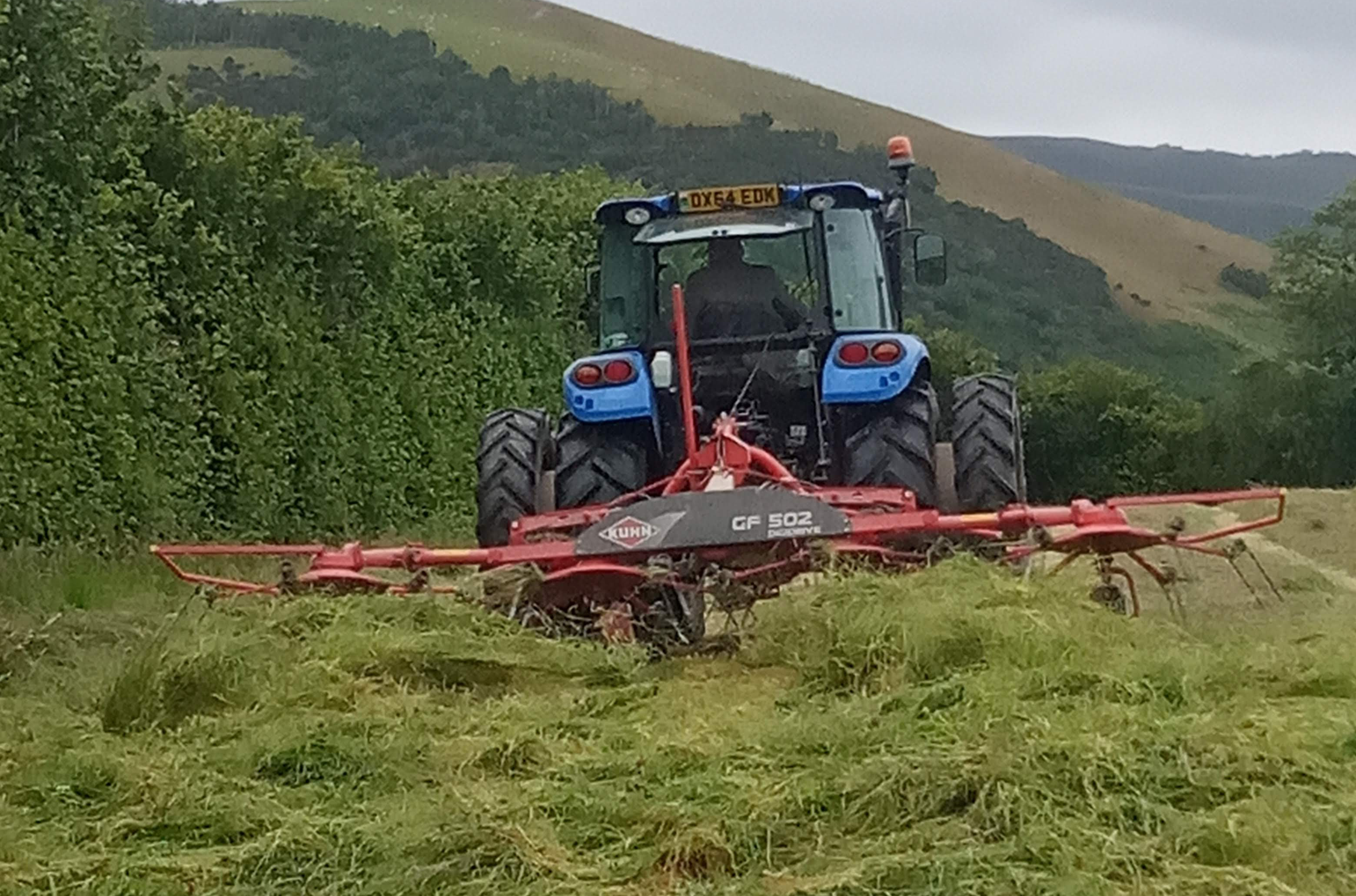 Tedding haylage in mid Wales with a New Holland tractor fitted with Stocks Ag Dual Wheels